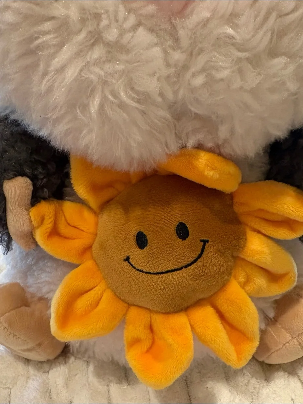 24” Russ sunflower cuddle Guinea Pig Plush holding a small yellow sunflower